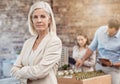 Serious, confident and assertive senior project manager leading team in planning. Female urban planner standing as her Royalty Free Stock Photo