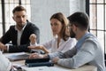 Serious confident businesswoman speaking, discussing project at corporate meeting Royalty Free Stock Photo