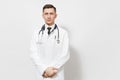 Serious confident experienced handsome young doctor man isolated on white background. Male doctor in medical gown, shirt Royalty Free Stock Photo