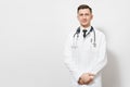 Serious confident experienced handsome young doctor man isolated on white background. Male doctor in medical gown, shirt Royalty Free Stock Photo