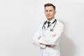 Serious confident experienced handsome young doctor man isolated on white background. Male doctor in medical uniform Royalty Free Stock Photo