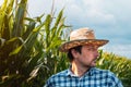 Serious corn farmer portrait in cultivated field