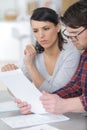 serious couple looking at paperwork together Royalty Free Stock Photo