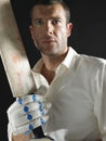 Serious Cricket Player With Bat