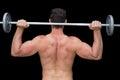 Serious crossfitter lifting up barbell behind head Royalty Free Stock Photo