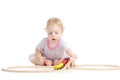 Serious cute child is playing with train