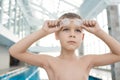 Purposeful boy dreaming of success in swimming contest