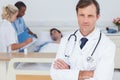 Serious doctor standing and looking at the camera Royalty Free Stock Photo
