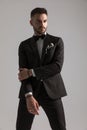 Serious elegant groom in black tuxedo looking to side Royalty Free Stock Photo