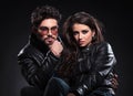 Serious fashion couple in leather jackets