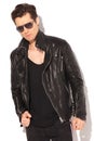 Serious fashion model in leather jacket and sunglasses Royalty Free Stock Photo