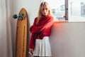 Blonde model in cute outfit with longboard Royalty Free Stock Photo