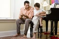 Serious father talking to teenage son at home Royalty Free Stock Photo