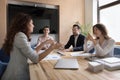 Serious female business partners talking at meeting table Royalty Free Stock Photo