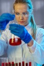 Serious female chemist working in laboratory Royalty Free Stock Photo