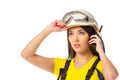 Serious female construction worker in helmet with goggles