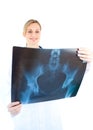 Serious female doctor looking at a x-ray Royalty Free Stock Photo