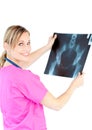 Serious female doctor looking at a x-ray Royalty Free Stock Photo