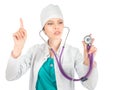 Serious female doctor with stethoscope showing atention sign Royalty Free Stock Photo