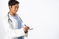 Serious female doctor writing on a note pad Royalty Free Stock Photo