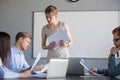 Serious female leader discussing results reading financial repor Royalty Free Stock Photo