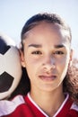Serious, female and young soccer athlete with a football ready for a workout, match or exercise. Portrait of a teen