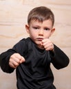 Serious Fighter Kid Posing with Closed Fists