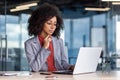 Serious focused and concentrated woman at workplace, thinking businesswoman looking at laptop screen, working inside Royalty Free Stock Photo