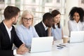 Serious focused diverse office employees group talking working o Royalty Free Stock Photo