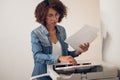 African American secretary preparing to make photocopies