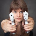 Serious girl aims from two pistols close up Royalty Free Stock Photo