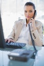 Serious gorgeous businesswoman answering the phone Royalty Free Stock Photo