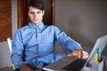 Serious about growing his business. Portrait of a successful young businessman sitting at his office desk. Royalty Free Stock Photo