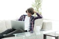 Serious guy working sitting near the desktop. Royalty Free Stock Photo