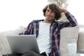 Serious guy working sitting near the desktop. Royalty Free Stock Photo