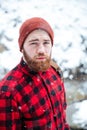 Serious handsome bearded man outdoors in snowy weather Royalty Free Stock Photo