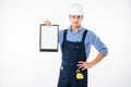 Serious handsome builder showing blank piece of paper on clipboard Royalty Free Stock Photo