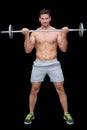 Serious handsome crossfitter lifting up barbell Royalty Free Stock Photo