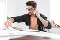 Serious handsome man in eyeglasses talking by smartphone Royalty Free Stock Photo