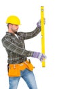 Serious handyman using spirit level Royalty Free Stock Photo