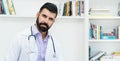 Serious hispanic mature doctor with beard Royalty Free Stock Photo