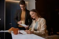 Serious husband holding paper asking wife about additional costs Royalty Free Stock Photo