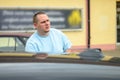 Serious intense young man in a parking lot Royalty Free Stock Photo