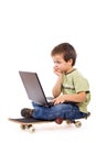 Serious kid mobile computing Royalty Free Stock Photo
