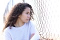 Serious latina girl looking away in the street Royalty Free Stock Photo