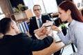 Serious lawyer gives adult man to sign document on divorce. Couple going through divorce signing papers.