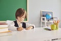 Serious little boy drawing picture during art class at school, empty space. First grader during lesson at classroom Royalty Free Stock Photo
