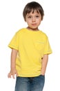 Serious little boy in yellow shirt