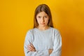 Serious little girl with cross arms on chest and look determined. Royalty Free Stock Photo