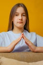 Serious little girl with cross arms and look determined Royalty Free Stock Photo